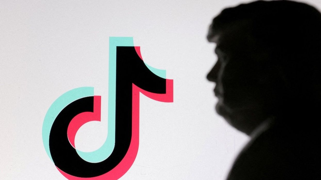 A 3D-printed miniature model of U.S. President-elect Donald Trump and TikTok logo are seen in this illustration. 