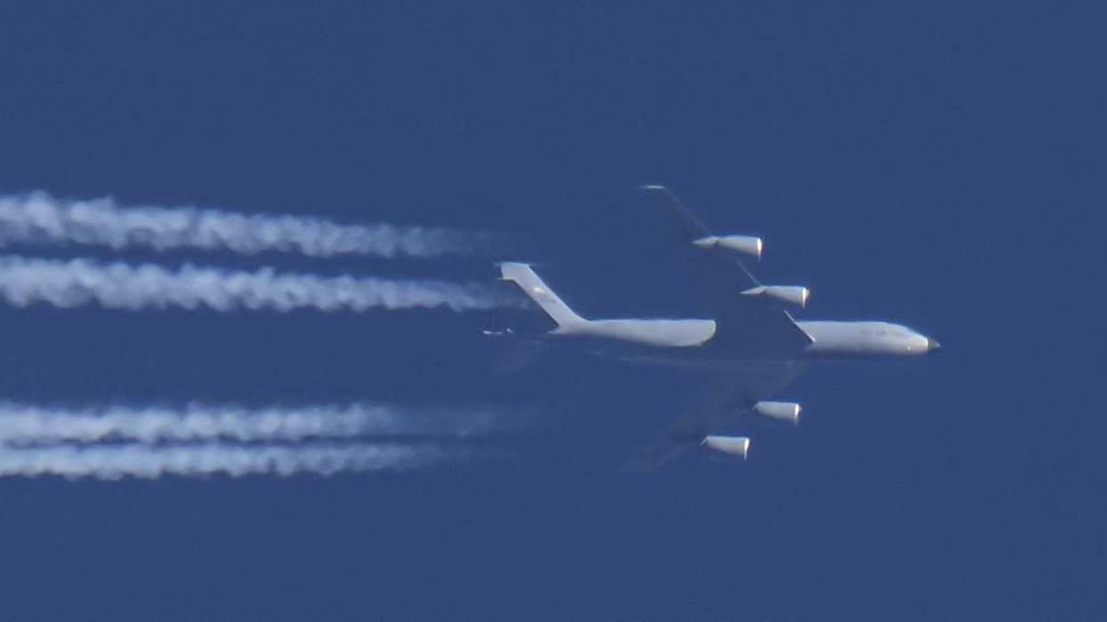 A Boeing C-135 Stratotanker / Stratolifter military aircraft known as KC-135 of the United States Air Force USAF configured as Air Tanker Transport for aerial refueling, powered by 4x CFMI jet engines and tail number 63-8003. The military plane spotted flying over the Netherlands in the blue sky from Mainland USA to Tel Aviv TLV to support the Israel USA - Iran war known as Operation Epic Fury by the US Department of Defense. Venlo, the Netherlands on March 2, 2026
