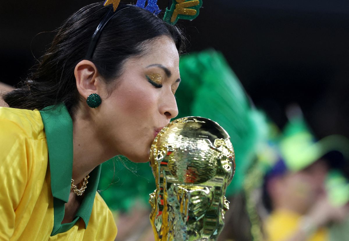 A Brazil fan with a replica World Cup trophy before the first-round match against Switzerland.