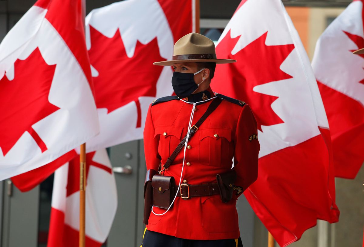 A Canadian mountie waits outside the Senate before the Throne Speech in Ottawa.
