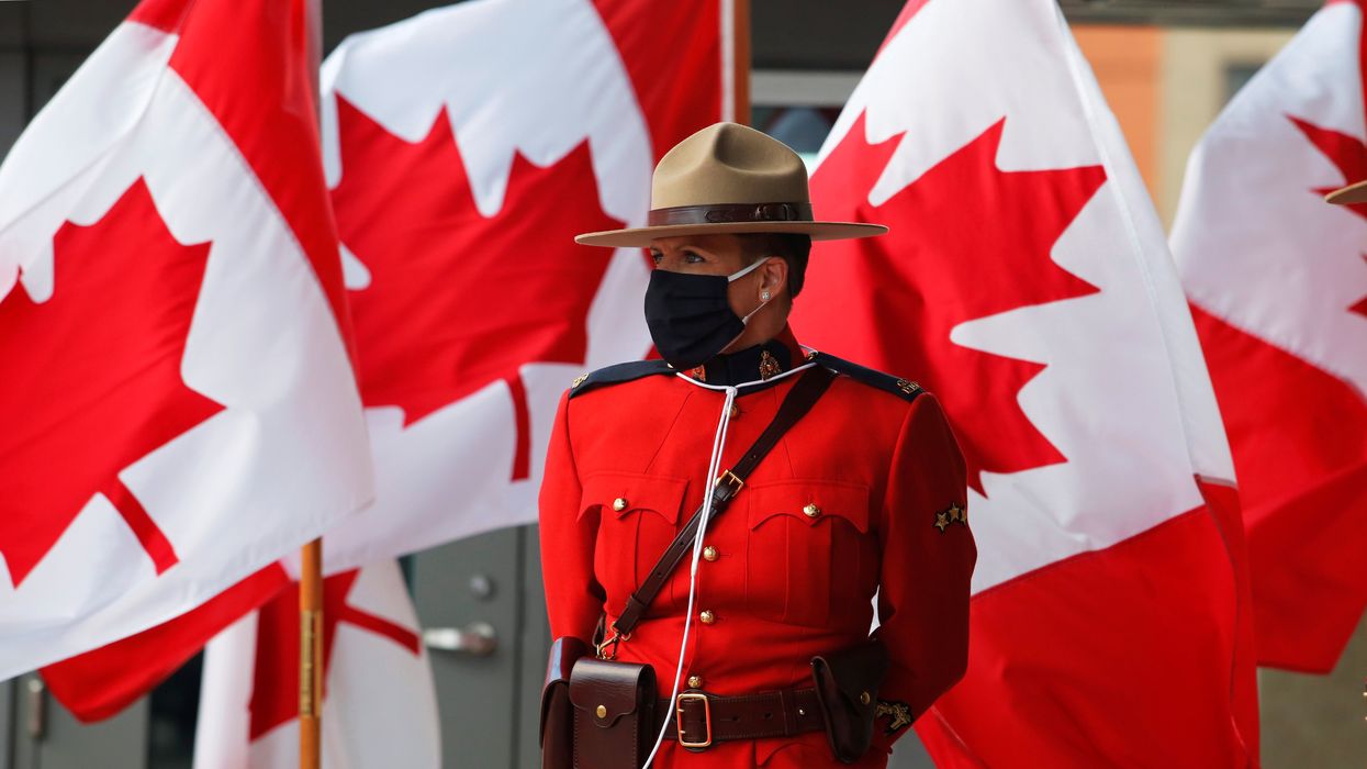 A Canadian mountie waits outside the Senate before the Throne Speech in Ottawa.