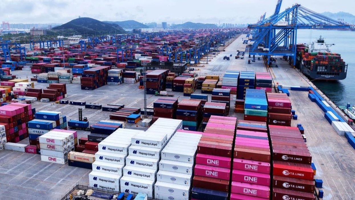 A cargo ship is loading and unloading foreign trade containers at Qingdao Port in Qingdao City, Shandong Province, China on May 7, 2025.