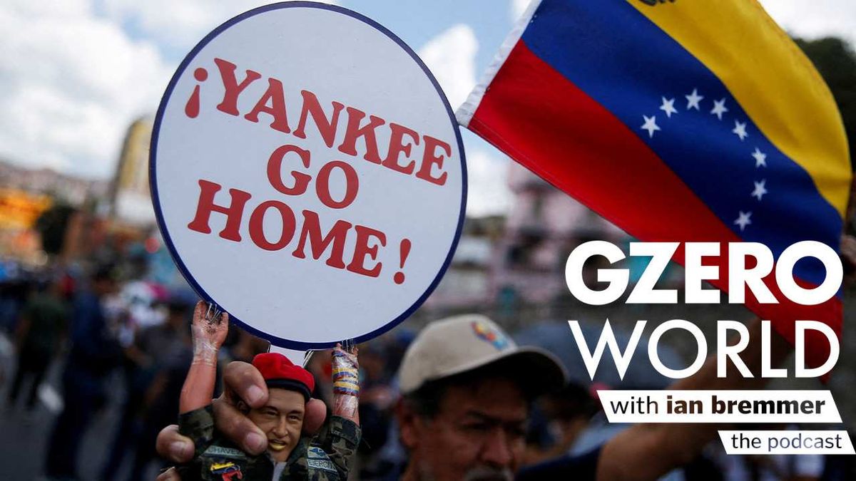 A Chavista holds a sign saying Yankee Go Home
