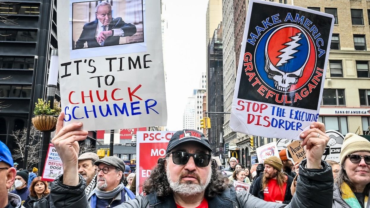 A coalition of labor unions, political action, and community groups march against DOGE and proposed cuts to Medicaid, housing, food assistance, and other vital programs in New York, New York, on March 15, 2025. Some expressed their outrage with Senator Chuck Schumer for voting to advance the Republican funding bill.