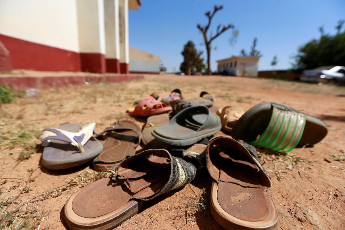 A collection of student footwears left behind after gunmen abducted students at the Government Science school in Kankara, in northwestern Katsina state, Nigeria December 13, 2020.