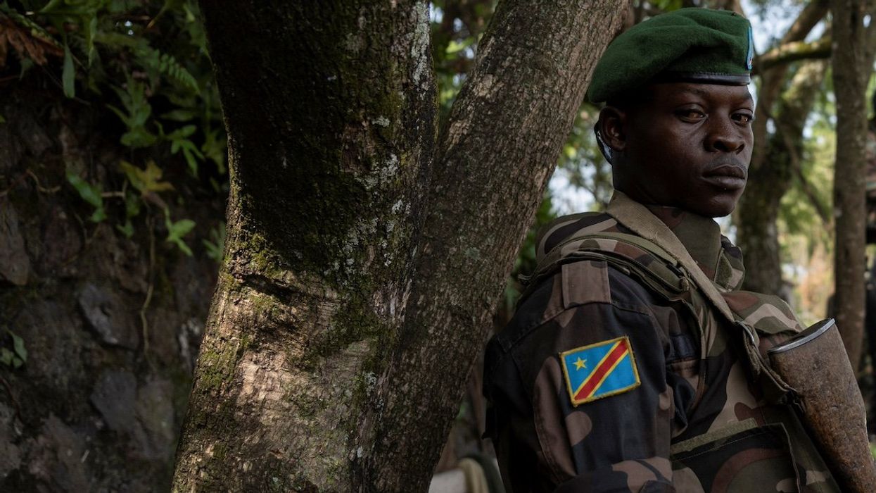 A Congolese soldier stands guard as he waits for the ceremony to repatriate the two bodies of South African soldiers killed in the ongoing war between M23 rebels and the Congolese army in Goma, North Kivu province of the Democratic Republic of Congo February 20, 2024.
