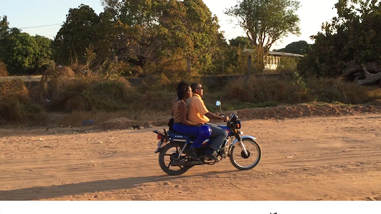 A couple on a motorcycle in Mozambique. Moving forward: powering Mozambique