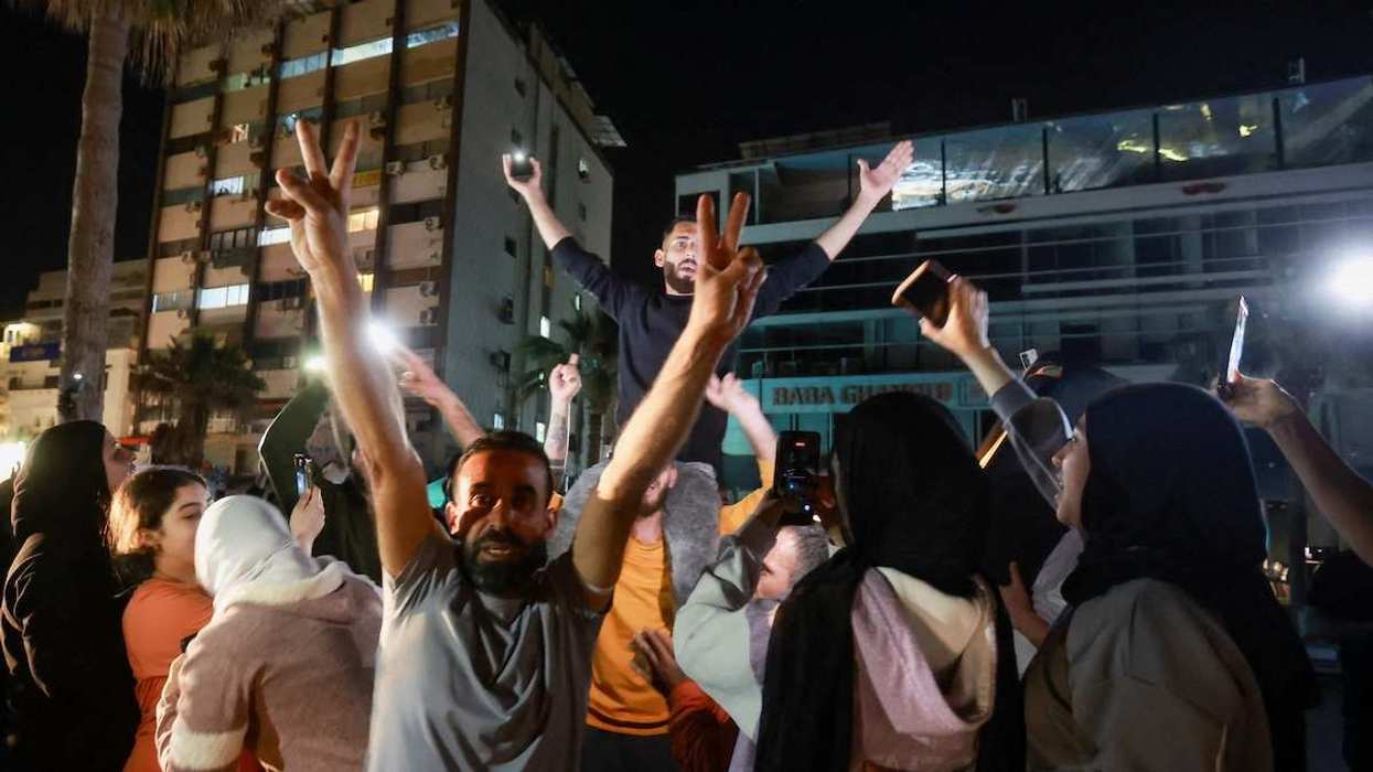 A crowd celebrates after a 10-day ceasefire between Lebanon and Israel went into effect, in Sidon, Lebanon, on April 17, 2026.