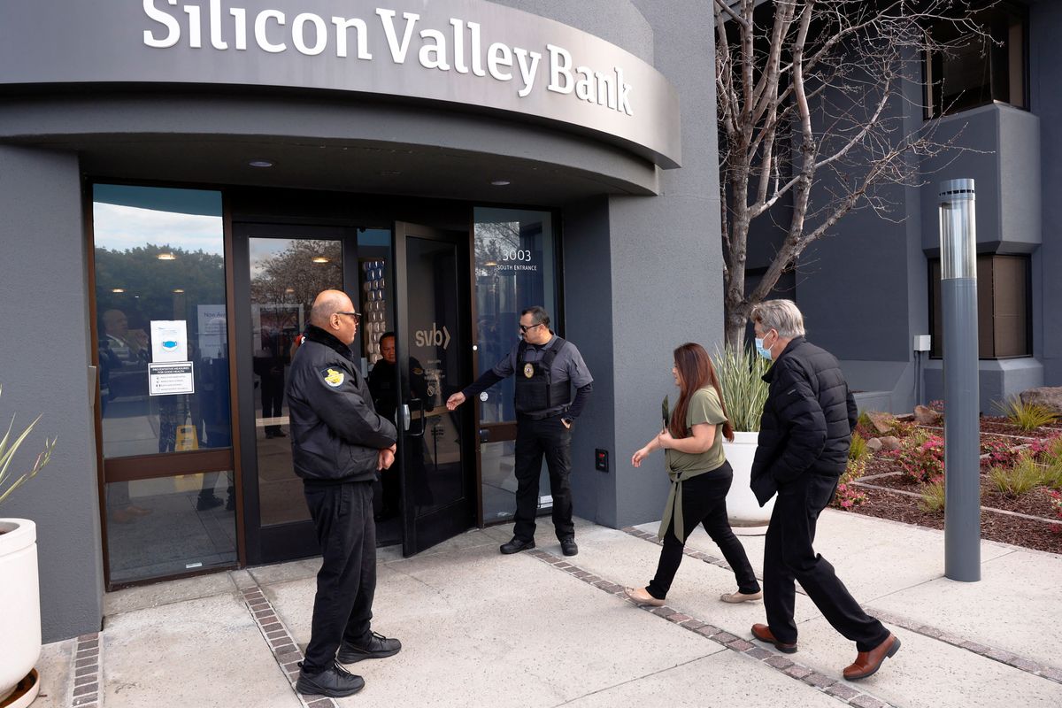 A customer is escorted into the Silicon Valley Bank headquarters in Santa Clara, California, on March 13, 2023. 