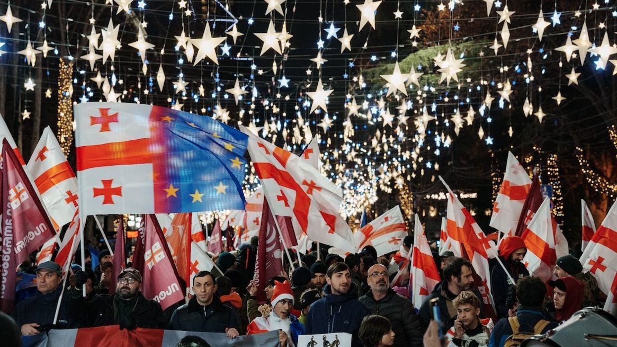 A day before the controversial inauguration of Georgian Dream loyalist Mikheil Kavelashvili as the country's new president, Georgian citizens demonstrate with pro-EU placards and Georgian, American, and European Union flags as they protest the government's decision to suspend European membership talks in Tbilisi, Georgia, on Dec. 28, 2024.