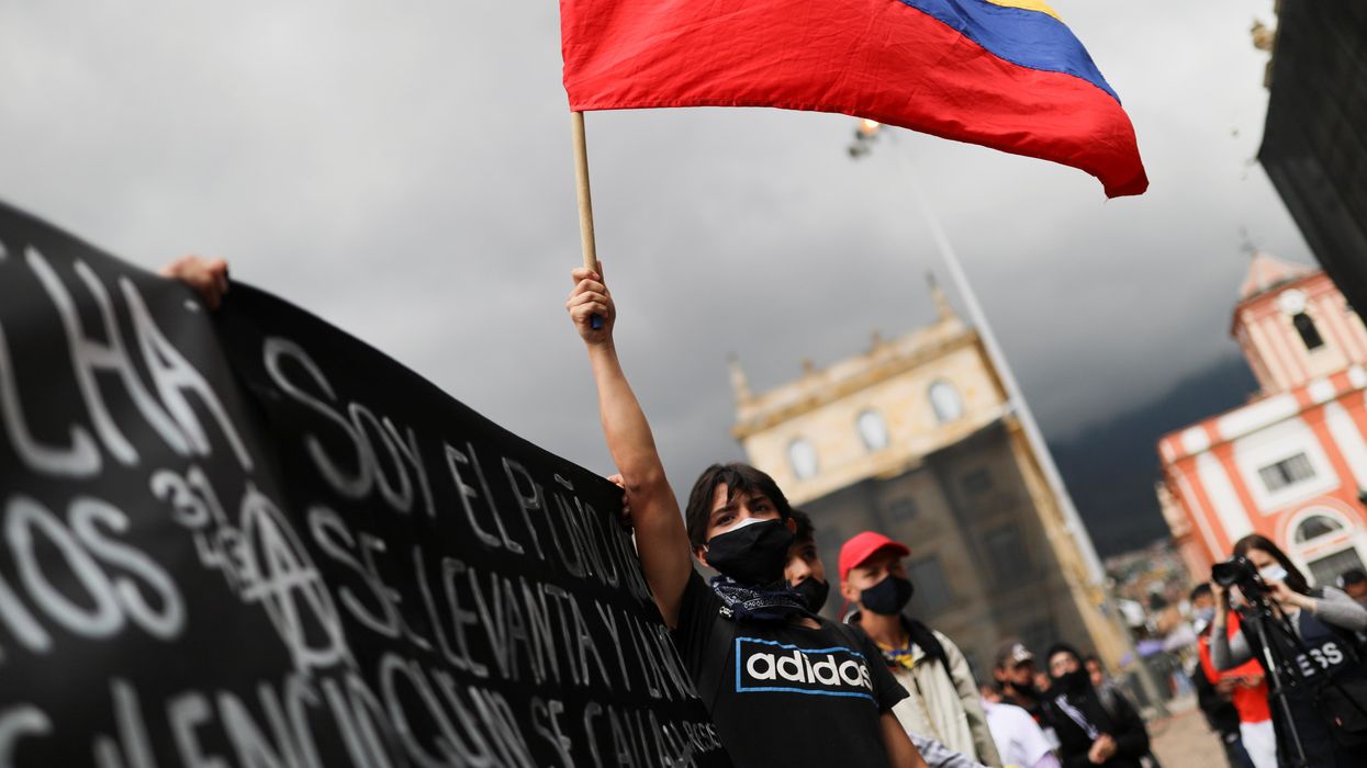 A demonstrator holds a flag during a protest against the tax reform of President Ivan Duque's government in Bogota, Colombia, April 29, 2021.