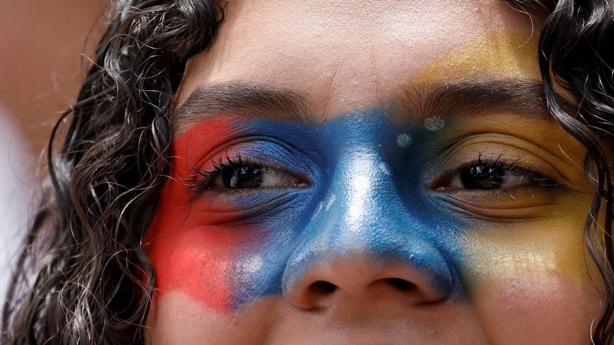 A demonstrator looks on during a protest against election results that awarded Venezuela's President Nicolas Maduro with a third term, in Caracas, Venezuela, August 3, 2024.