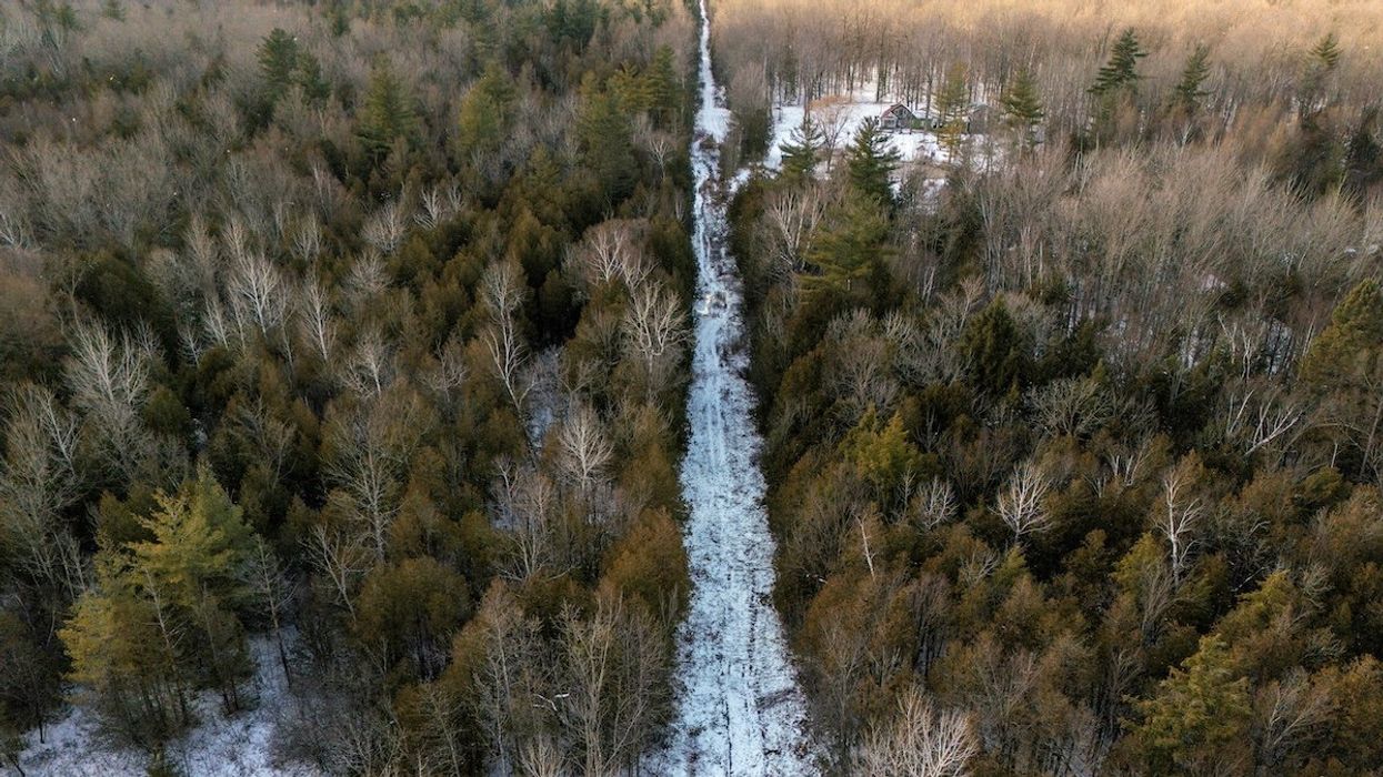 A drone view shows the Canada-U.S. border between the U.S. state of New York and the Canadian province of Quebec, near Champlain, New York, U.S., December 6, 2024.