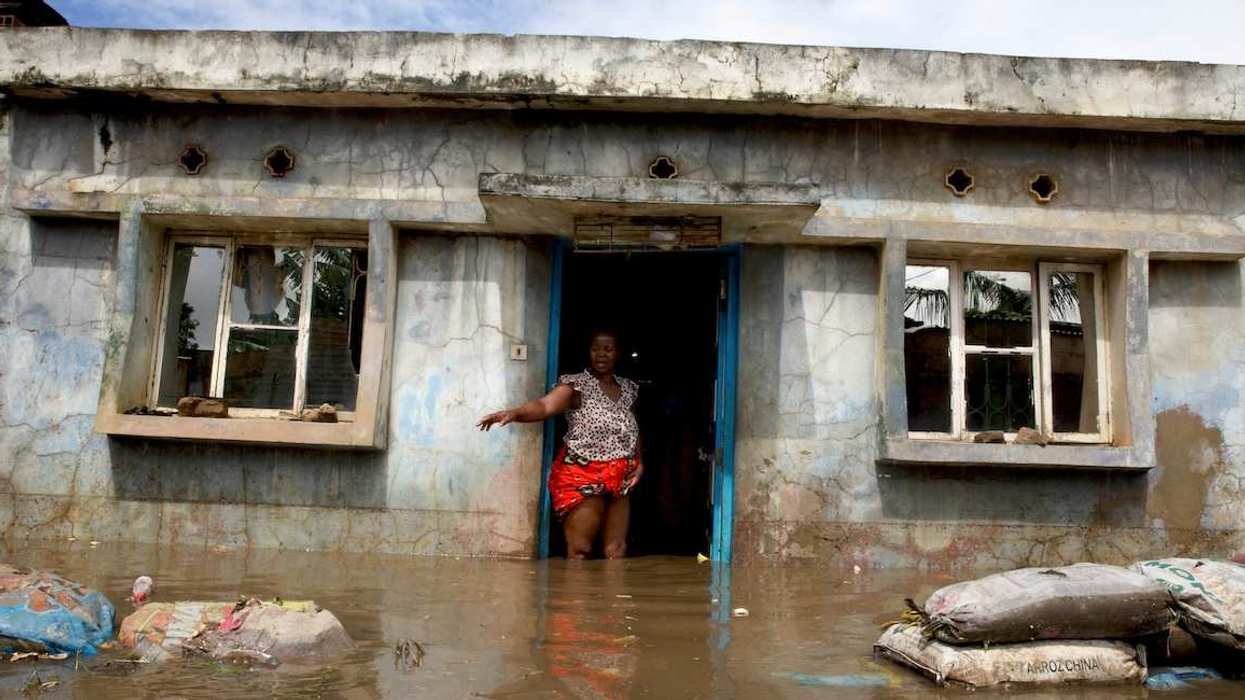 A flood victim stands at her flooded home after weeks of heavy rainfall in Boane District, Maputo, Mozambique, January 19, 2026.