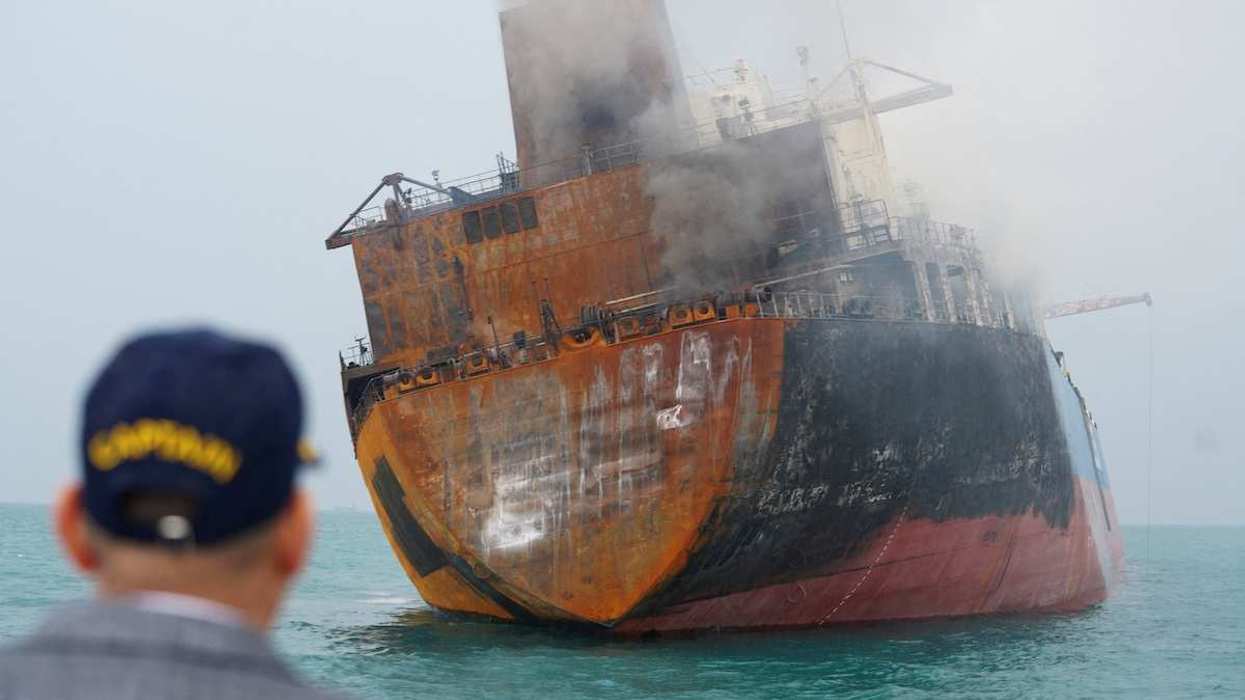 A foreign tanker carrying Iraqi fuel oil damaged after catching fire in Iraq's territorial waters, following unidentified attacks that targeted two foreign tankers, according to Iraqi port officials, near Basra, Iraq, March 12, 2026.