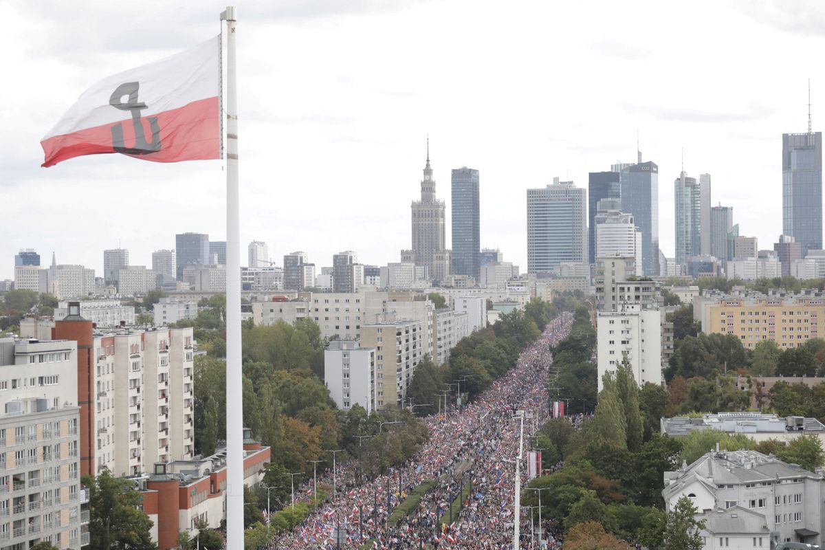 A giant Second World War Polish Home Army flag is seen, as participants attend the "March of a Million Hearts" rally, organised by the Civic Coalition opposition parties, two weeks ahead of the parliamentary election, in Warsaw, Poland October 1, 2023.