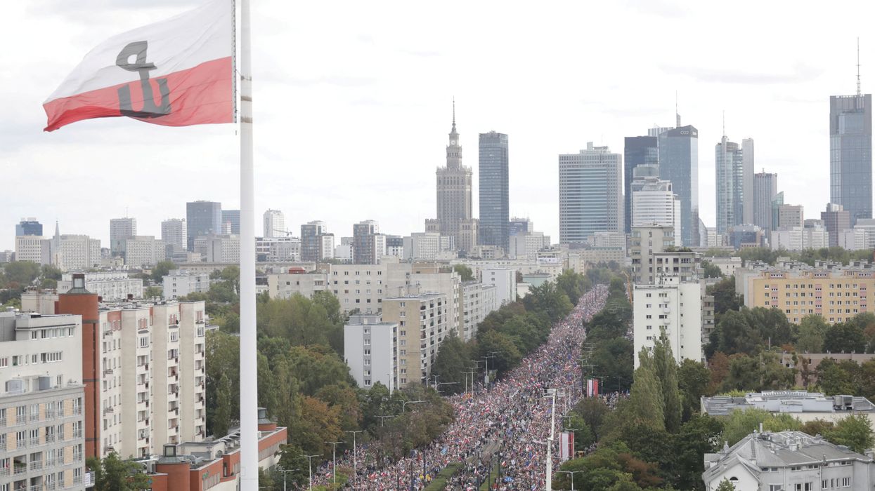 A giant Second World War Polish Home Army flag is seen, as participants attend the "March of a Million Hearts" rally, organised by the Civic Coalition opposition parties, two weeks ahead of the parliamentary election, in Warsaw, Poland October 1, 2023.