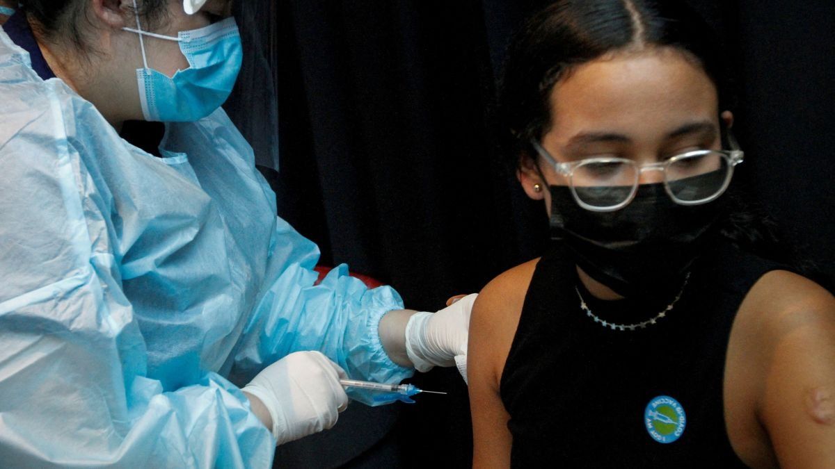 ​A girl is inoculated against the coronavirus disease (COVID-19) in Miami, Florida, USA, on August 5, 2021.