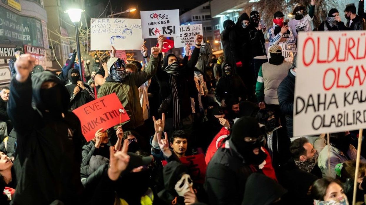 A group demonstrators chant slogans together as they hold posters during the protest. The ongoing protests were sparked by the arrest of Istanbul Metropolitan Mayor Ekrem Imamoglu.