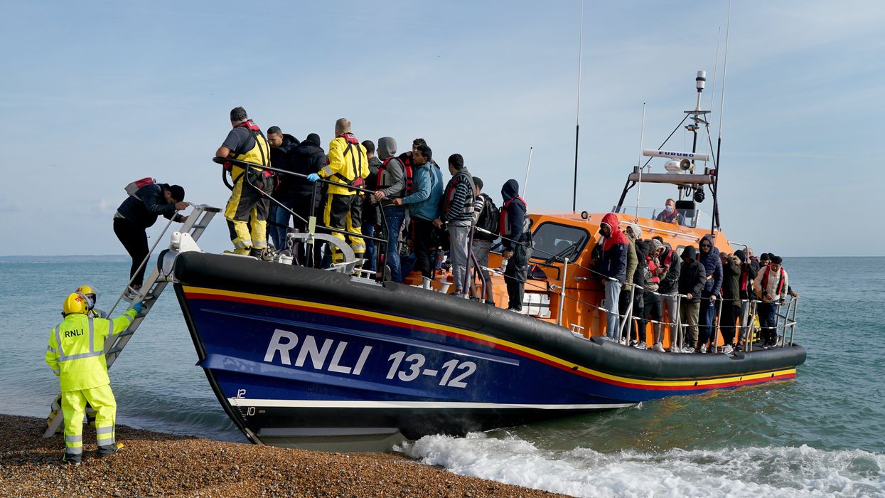 A group of people thought to be migrants arrive in Dungeness, Kent, after being rescued in the Channel by the RNLI following following a small boat incident.