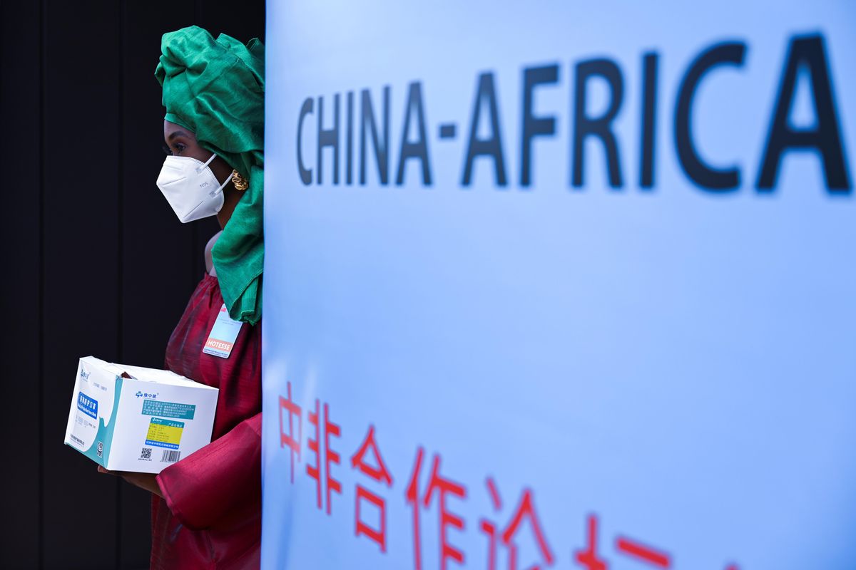 A hostess stands before the opening of the Forum on China-Africa Cooperation, (FOCAC) in Dakar, Senegal November 29, 2021.