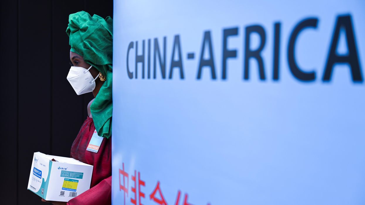 A hostess stands before the opening of the Forum on China-Africa Cooperation, (FOCAC) in Dakar, Senegal November 29, 2021.