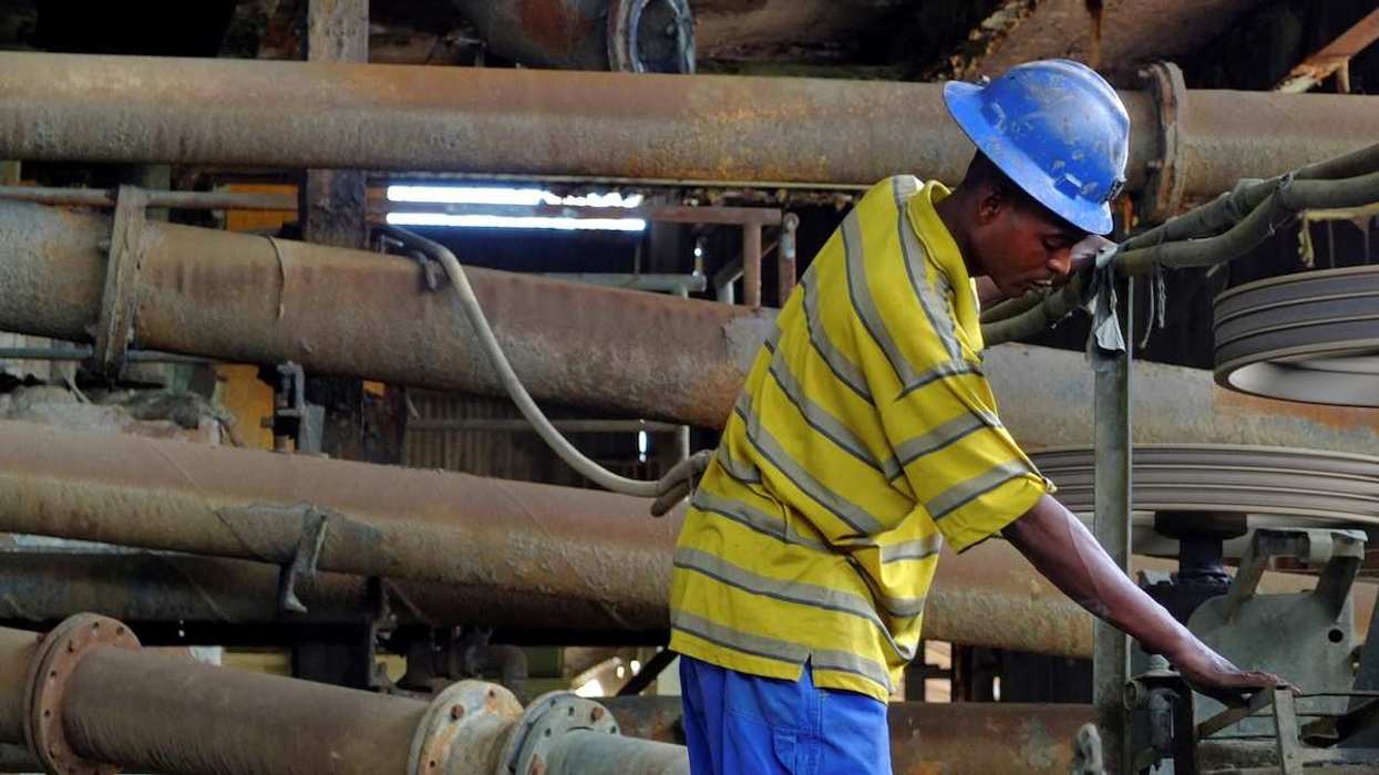 A laborer works at the Congolese state mining company Gecamines' copper concentrator at its Kambove operation in the southern province of Katanga