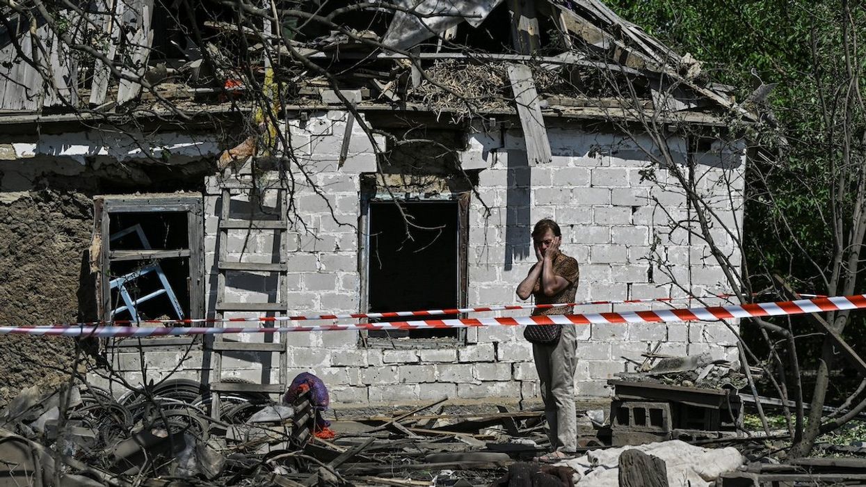 A local resident reacts next to a residential building damaged by a Russian missile strike in the village of Novohupalivka, amid Russia's attack on Ukraine, in Zaporizhzhia region, Ukraine August 26, 2024.
