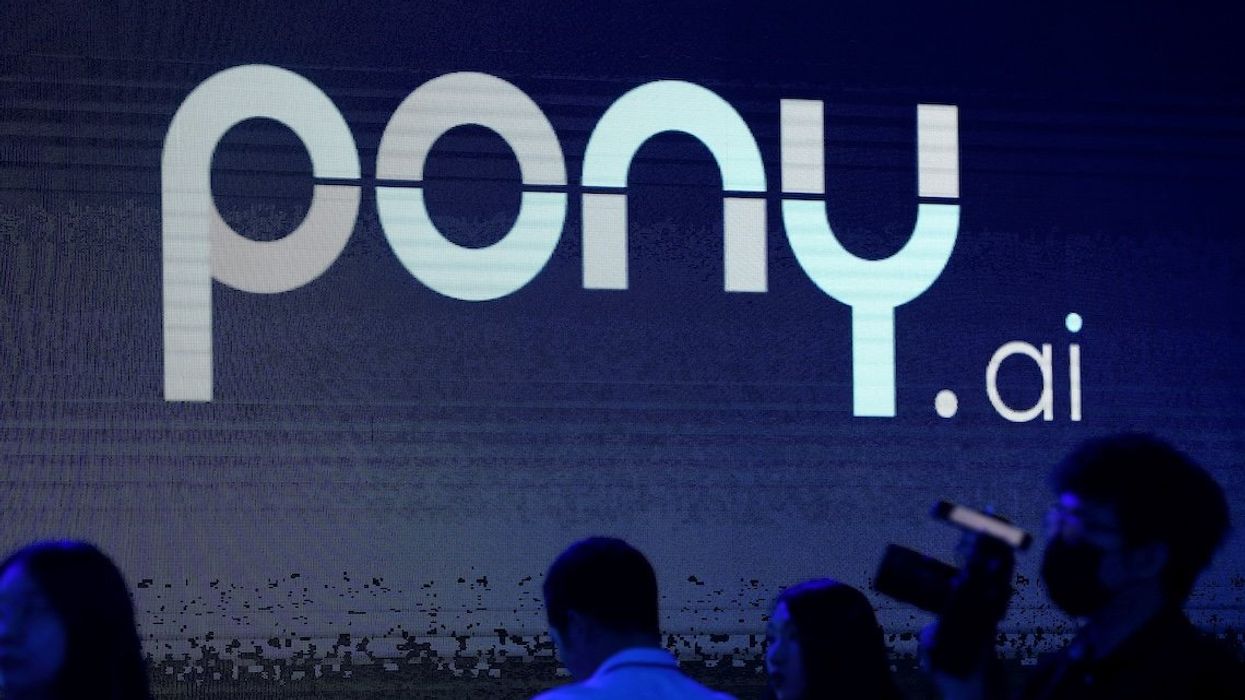 A logo of the autonomous driving technology startup Pony.ai is seen on a screen during an event in Beijing, China, in 2021.