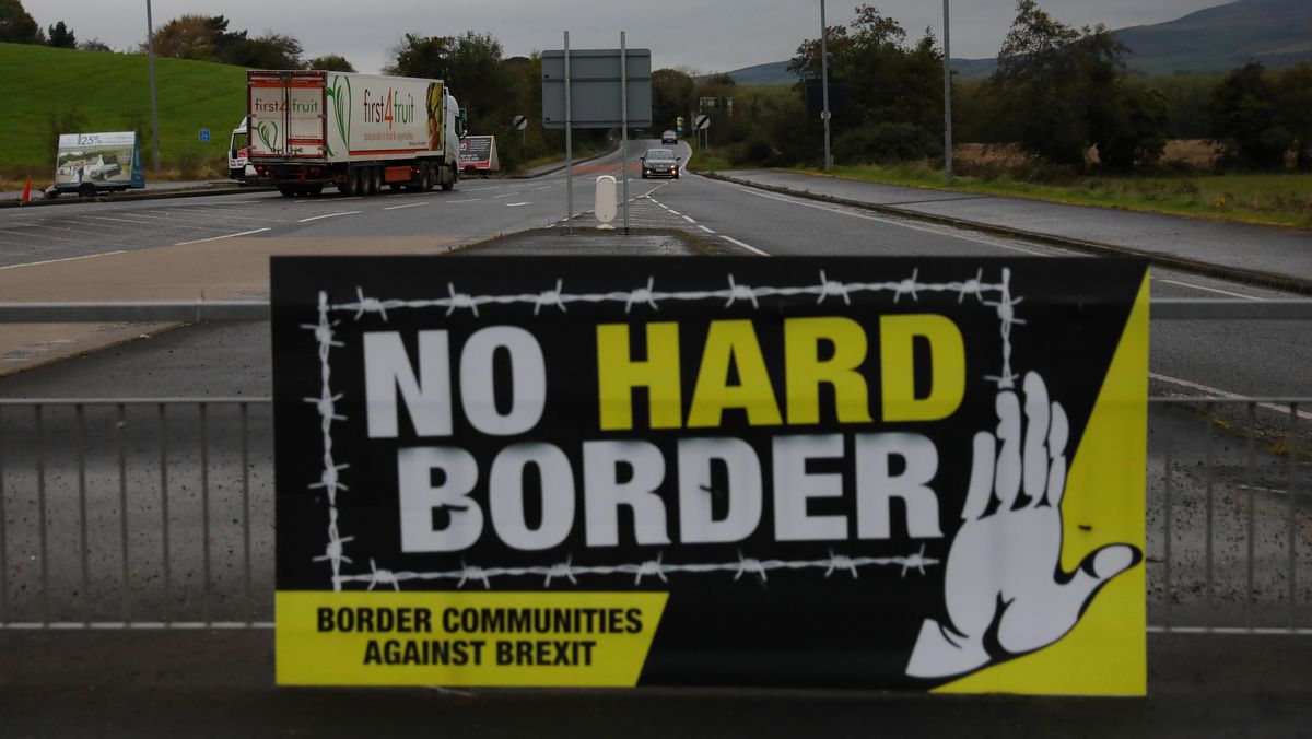 A lorry drives past a 'No Hard Border' poster near Londonderry, Northern Ireland October 15, 2019