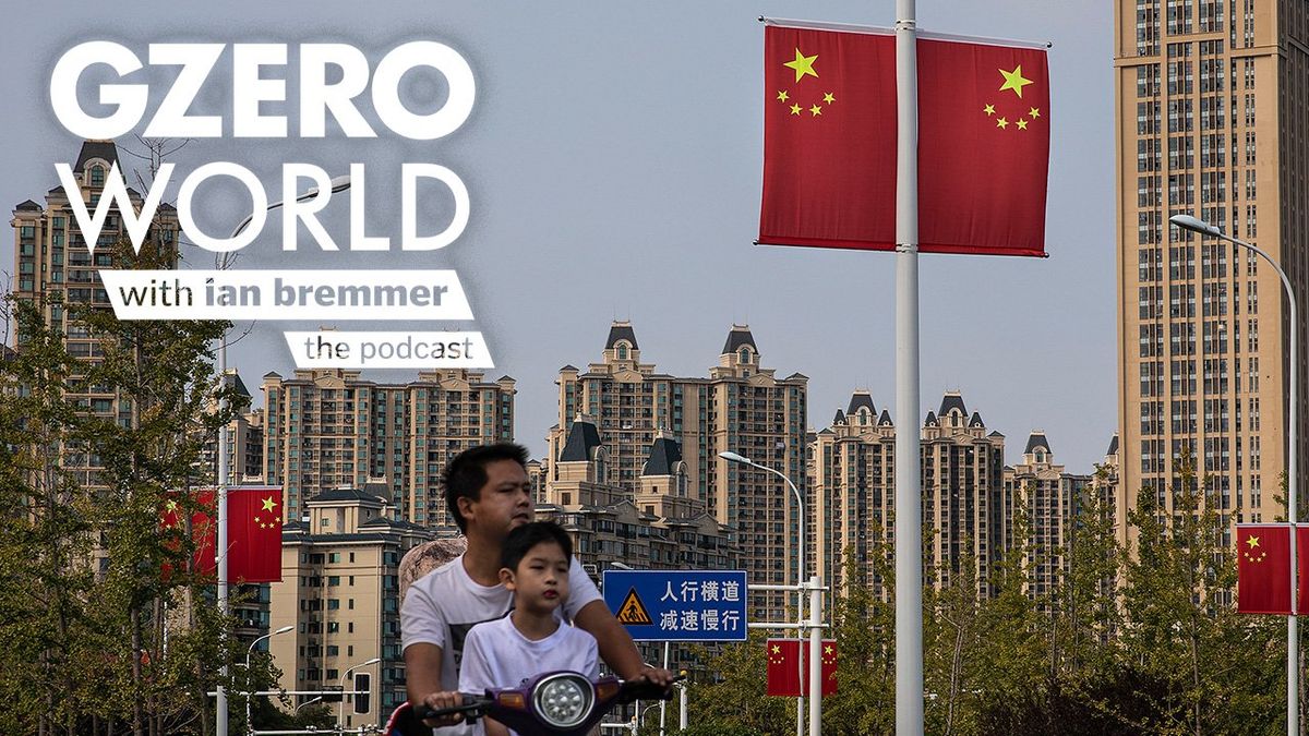 a man and boy on a bike and Chinese flags attached to street lights and GZERO World with ian bremmer - the podcast
