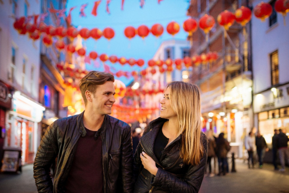 A man and woman smiling at each other