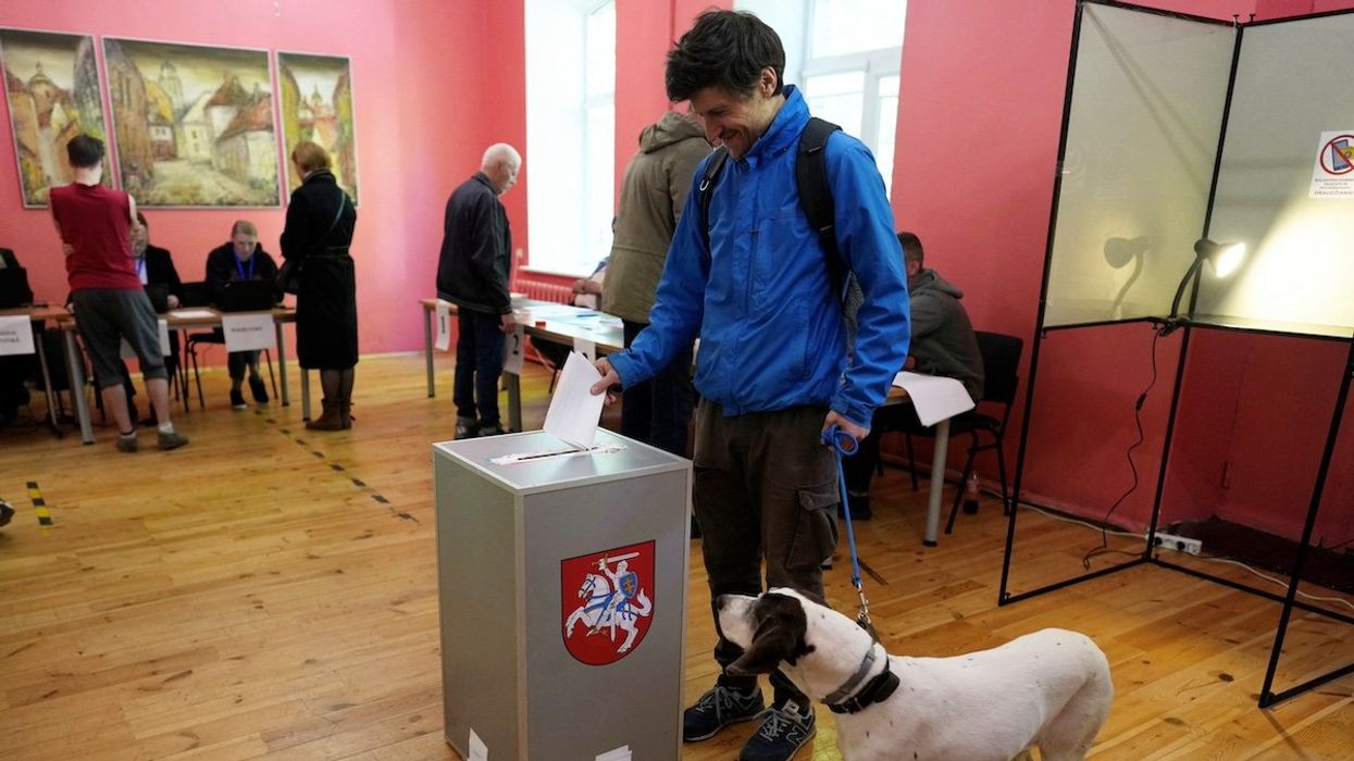 A man casts his vote during a presidential election in Vilnius, Lithuania May 12, 2024.