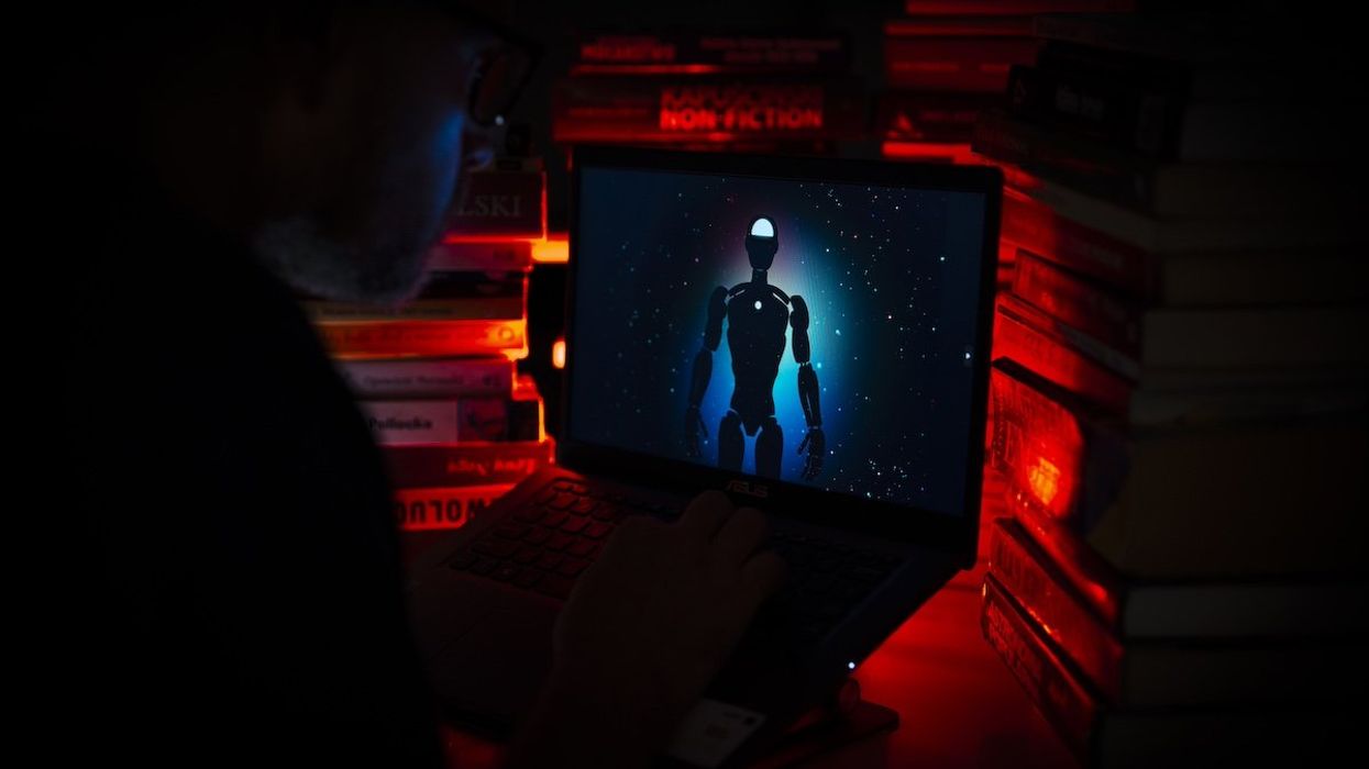 A man is seen using the OpenAI ChatGPT artificial intelligence chat website in this illustration photo on 18 July, 2023.