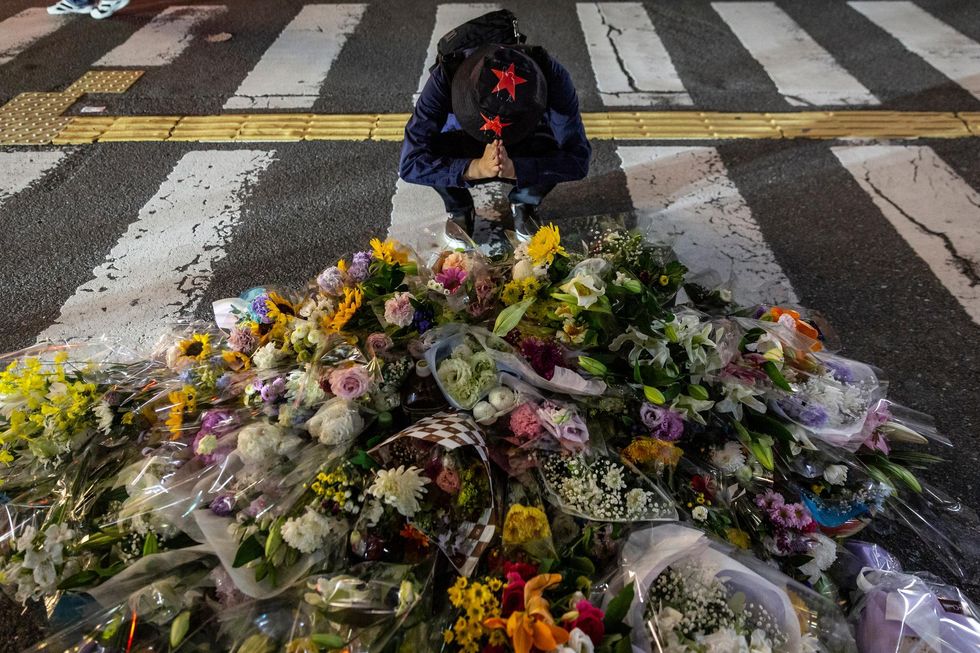 A man mourns the death of former PM Abe where he was shot dead.