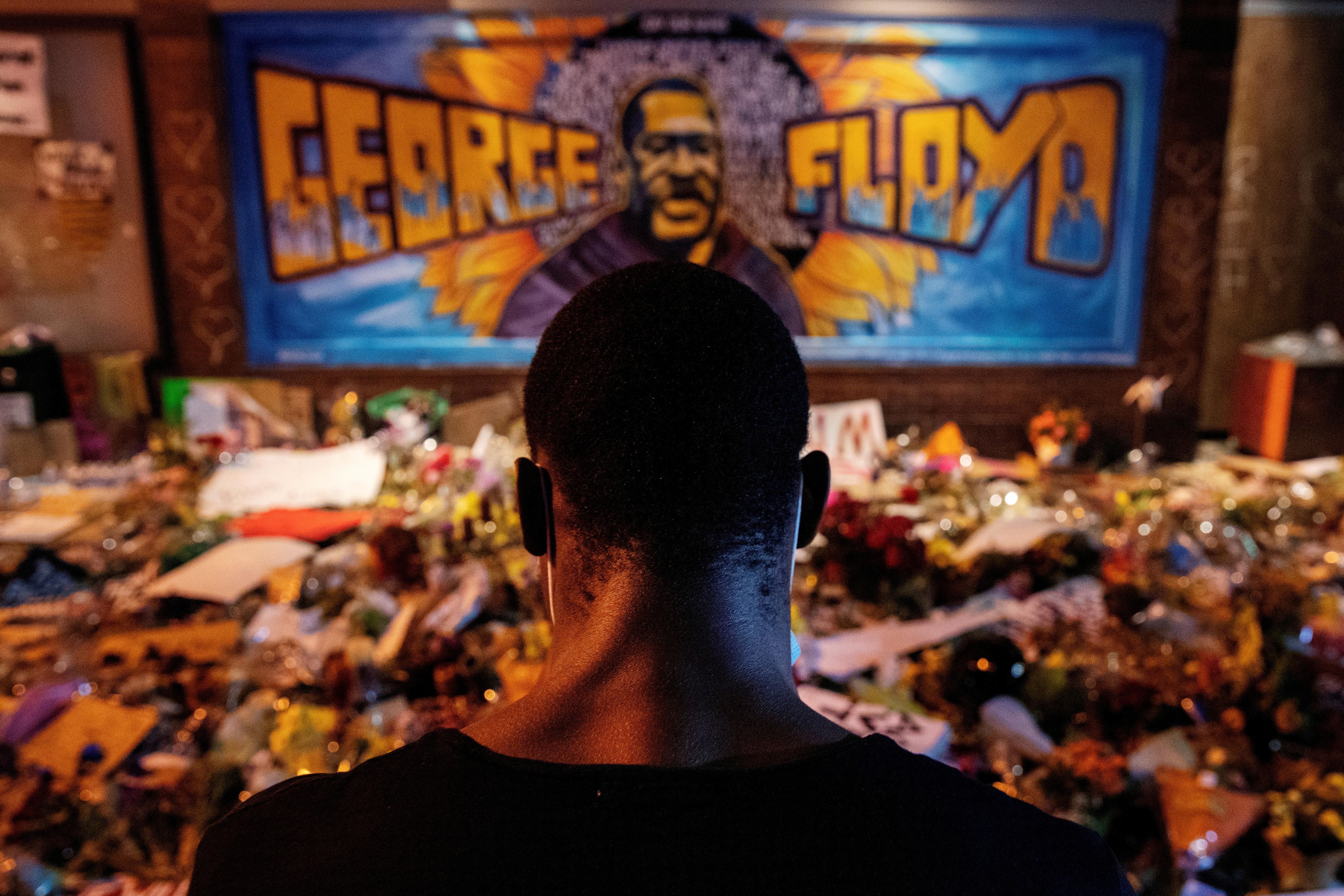 A man recites spoken word poetry at a makeshift memorial honoring George Floyd, at the spot where he was taken into custody, in Minneapolis, Minnesota, U.S., June 1, 2020. 