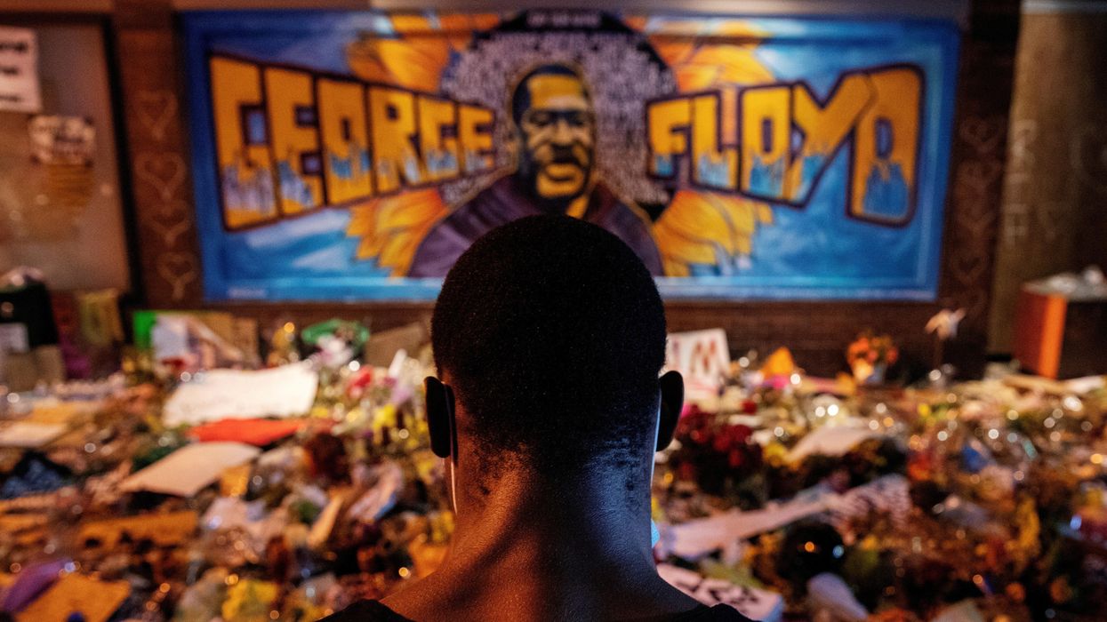 A man recites spoken word poetry at a makeshift memorial honoring George Floyd, at the spot where he was taken into custody, in Minneapolis, Minnesota, U.S., June 1, 2020.