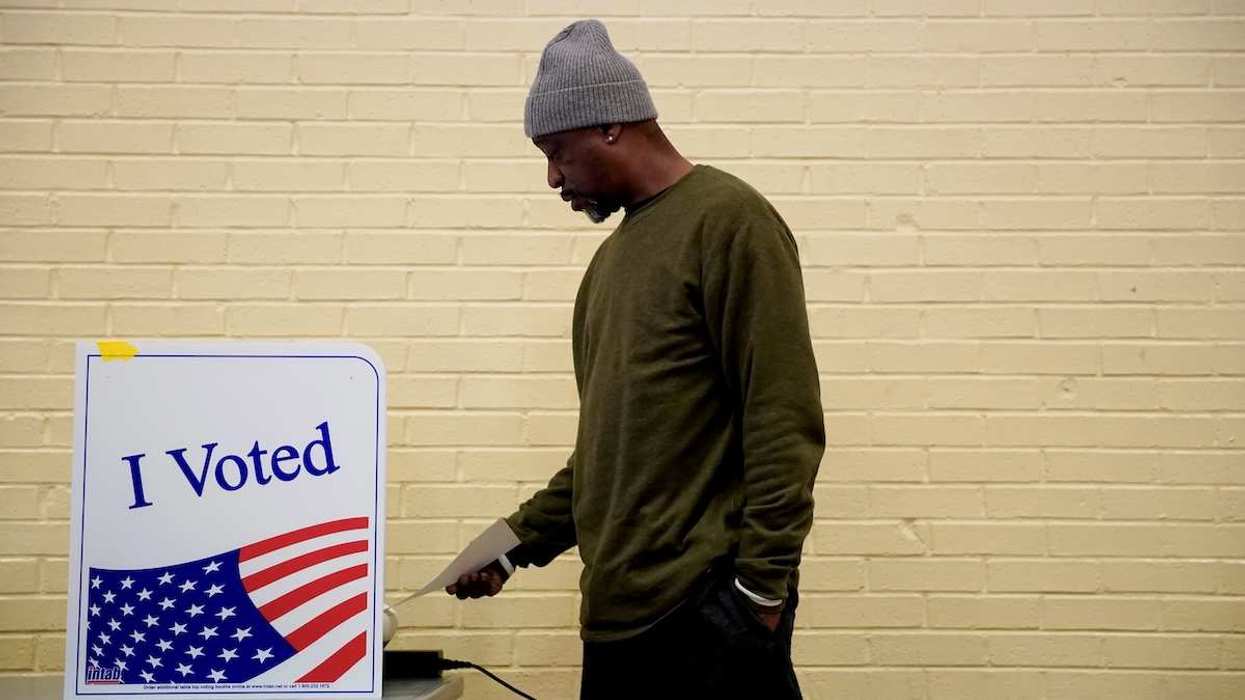 A man votes at a polling station in South Carolina's Democratic presidential primary in Columbia.