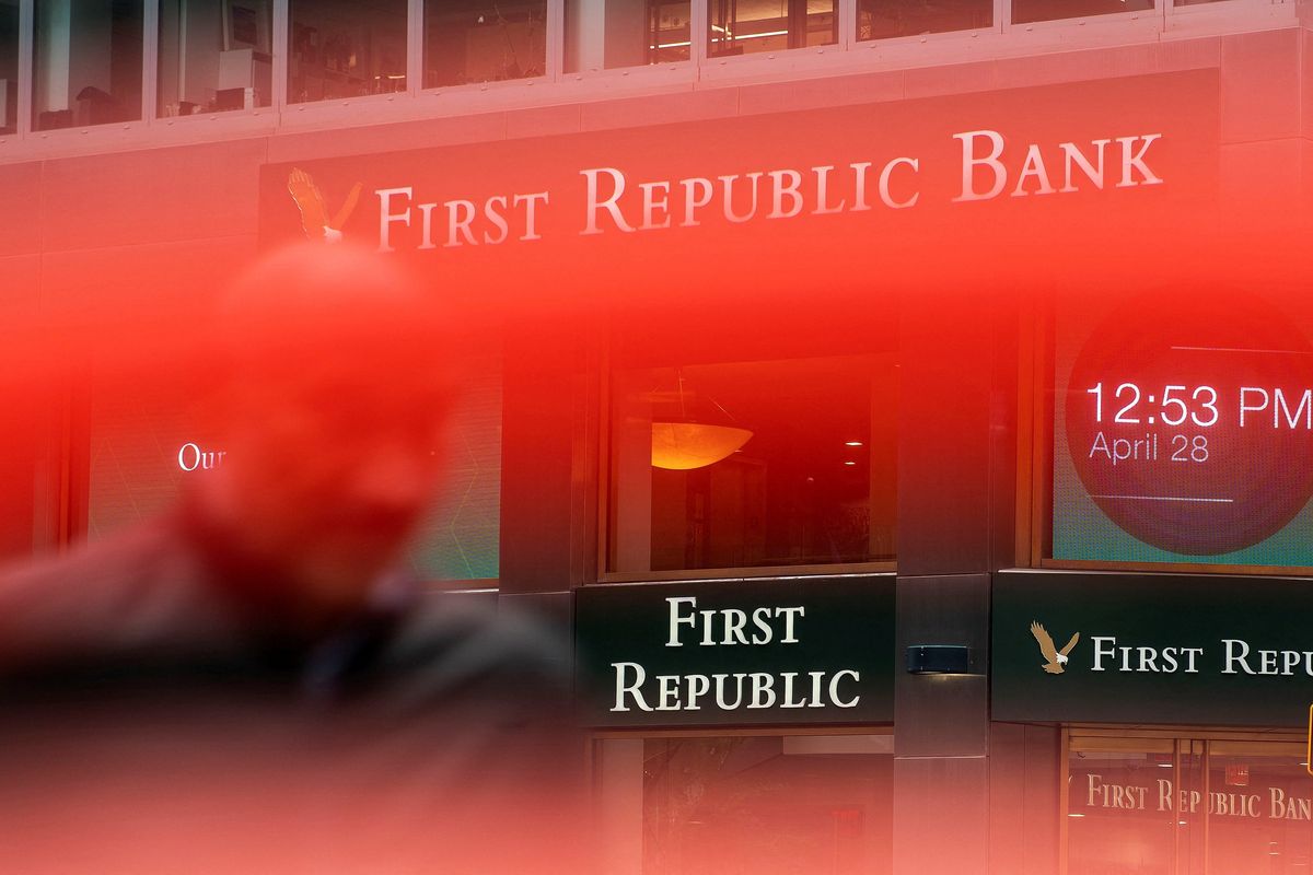 A man walks near a First Republic Bank branch in New York City.