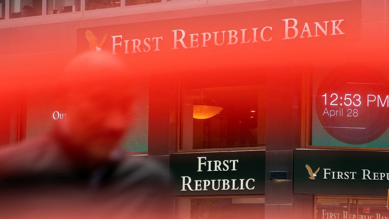 A man walks near a First Republic Bank branch in New York City.