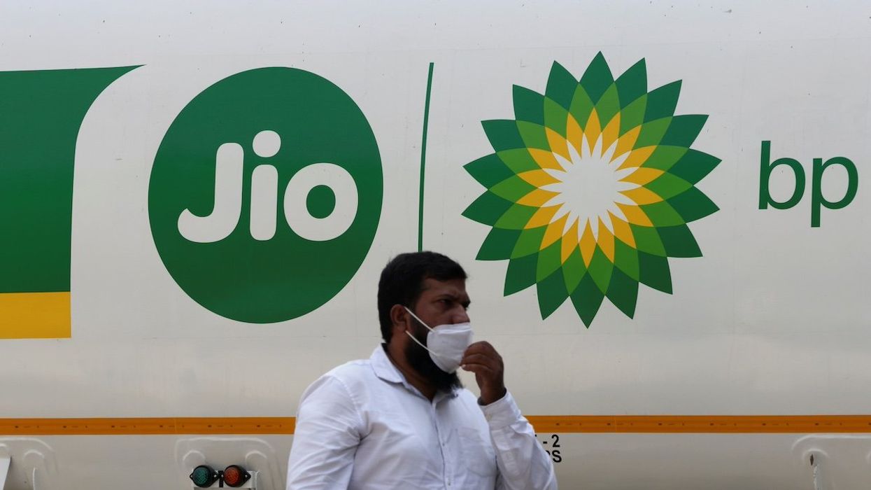 A man walks past a Jio-bp fuel tanker, an Indian fuel and mobility joint venture between Reliance Industries (RIL) and British Petroleum (bp), in Navi Mumbai, India, October 26, 2021