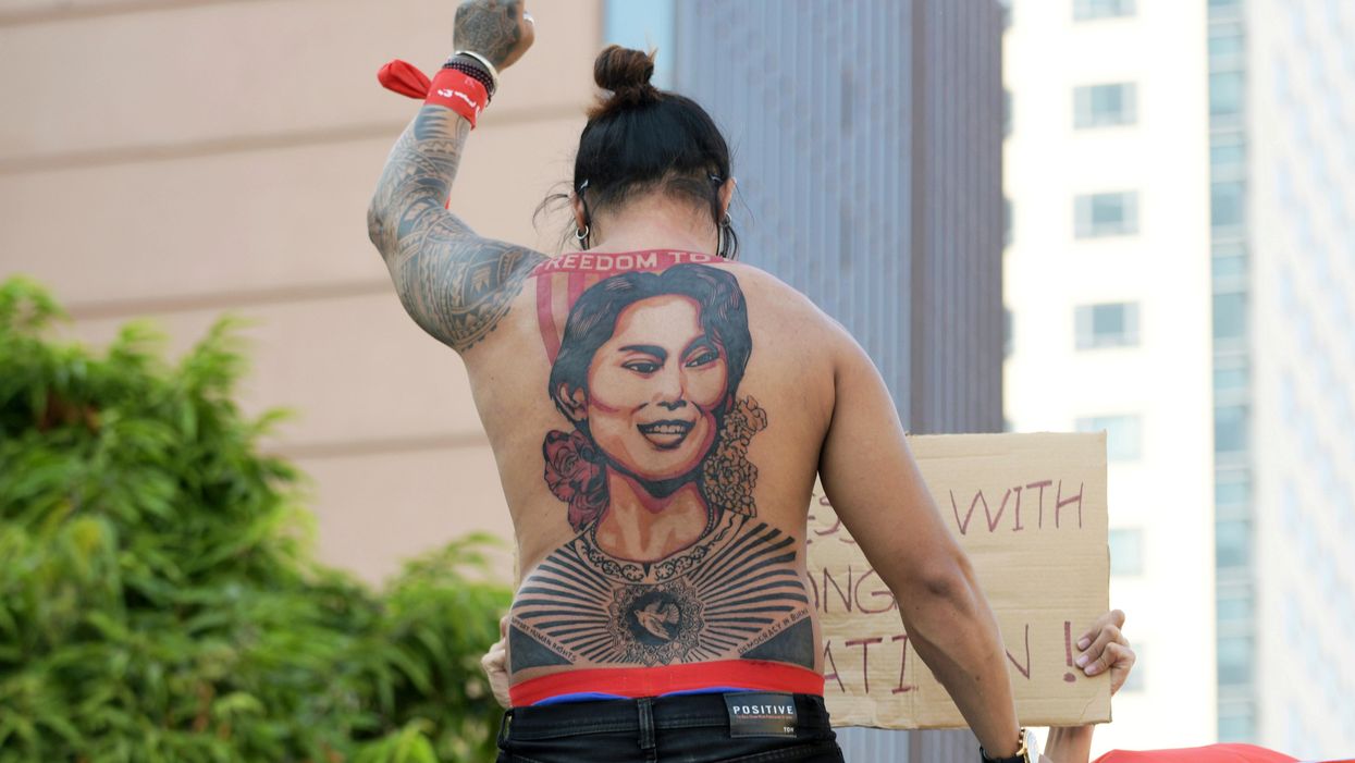 A man with a tattoo of Aung San Suu Kyi takes part in a protest against the military coup and to demand the release of the elected leader in Yangon, Myanmar, February 8, 2021.