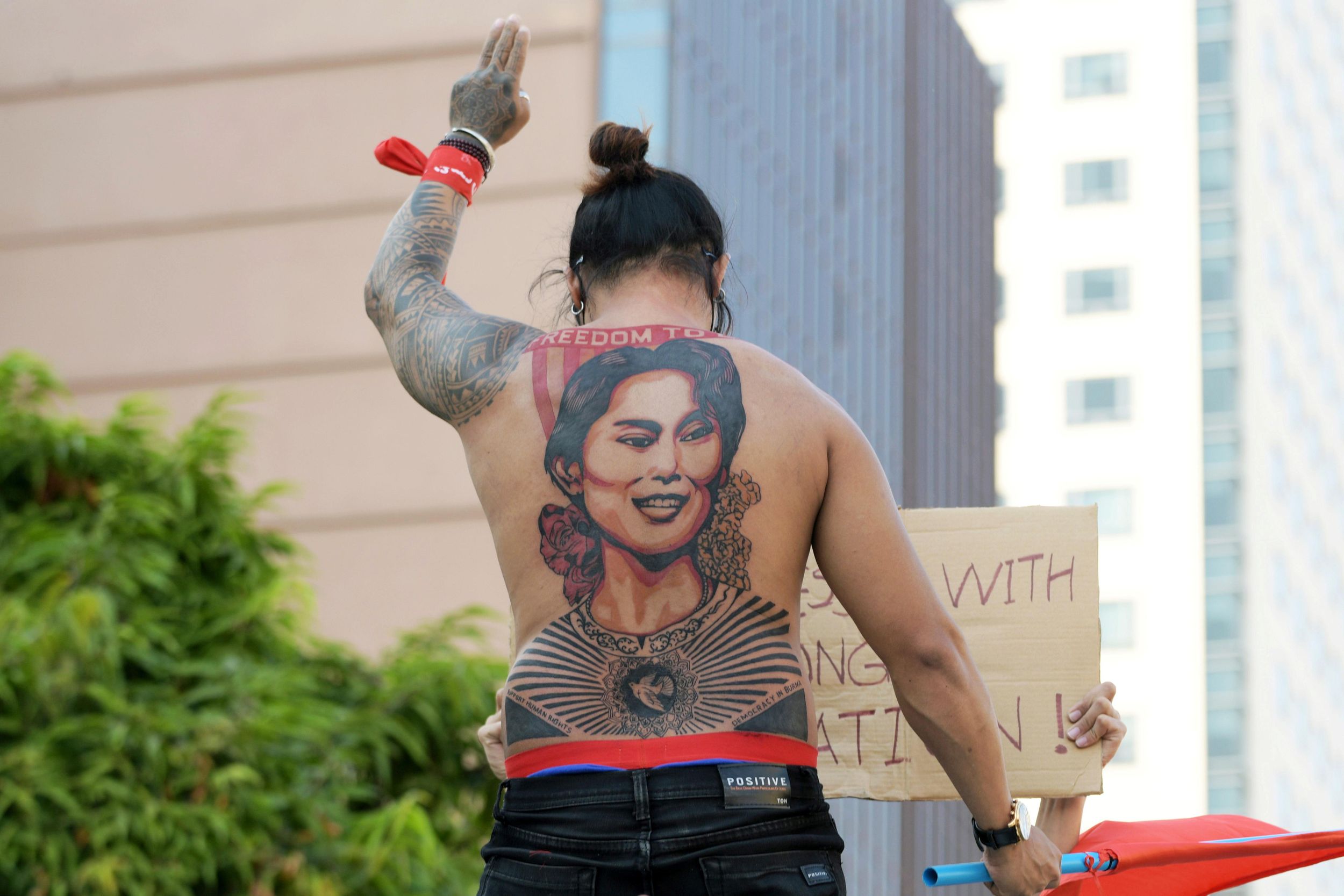 A man with a tattoo of Aung San Suu Kyi takes part in a protest against the military coup and to demand the release of the elected leader in Yangon, Myanmar, February 8, 2021.