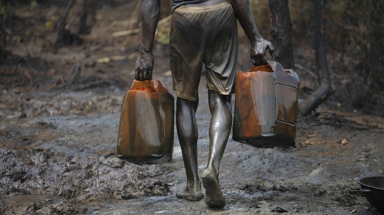 A man works at an illegal oil refinery site in Bayelsa, Nigeria.