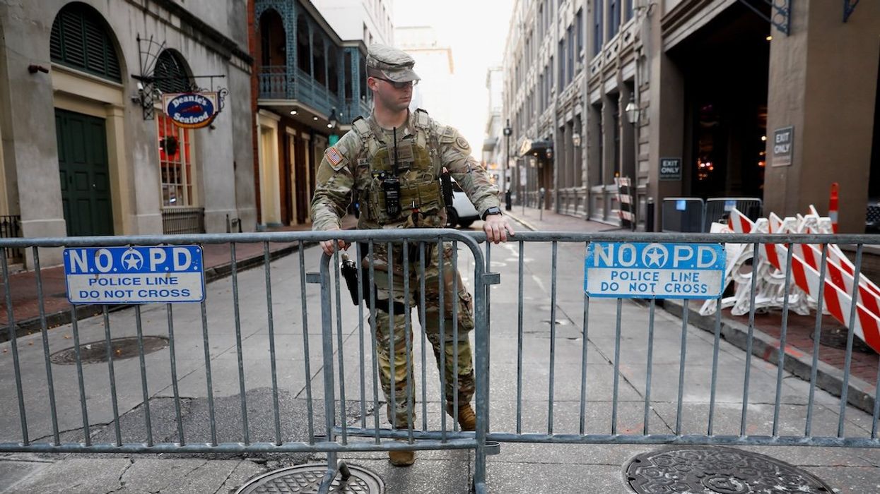 A member of the National Guard Military Police stands in the area where people were killed by a man driving a truck in an attack during New Year's celebrations, in New Orleans, Louisiana, on Jan. 2, 2025.