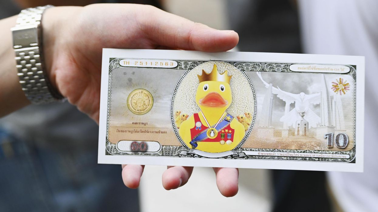 A mock 10 baht banknote bearing an illustration of a yellow duck instead of the Thai king or his predecessor is pictured in Bangkok on Nov. 25, 2020.