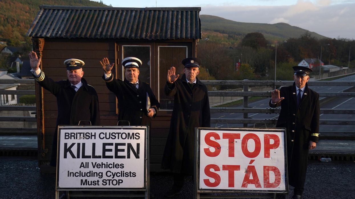 A mock customs post is set up with protesters from border communities between Ireland and Northern Ireland against Brexit.