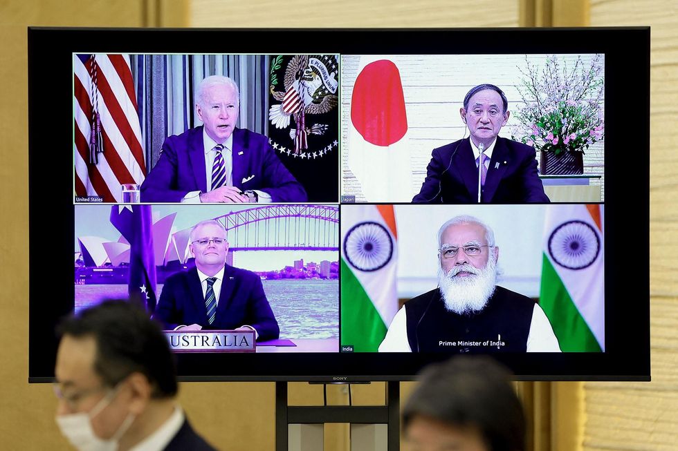 A monitor displaying a virtual meeting with leaders from the the Quadrilateral Security Dialogue (Quad) countries.