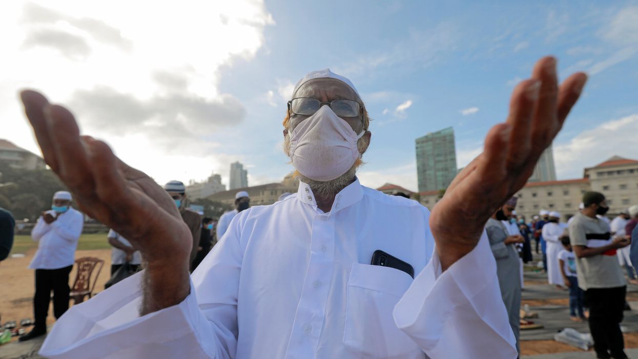 A Muslim man wearing a protective mask practice social distancing as he attends a prayer to mark the Hajj festival, amid concerns about the spread of the coronavirus disease (COVID-19), in Colombo, Sri Lanka, August 1, 2020.