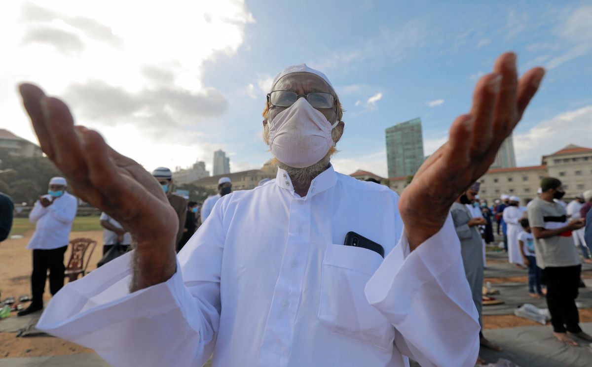 A Muslim man wearing a protective mask practice social distancing as he attends a prayer to mark the Hajj festival, amid concerns about the spread of the coronavirus disease (COVID-19), in Colombo, Sri Lanka, August 1, 2020. 